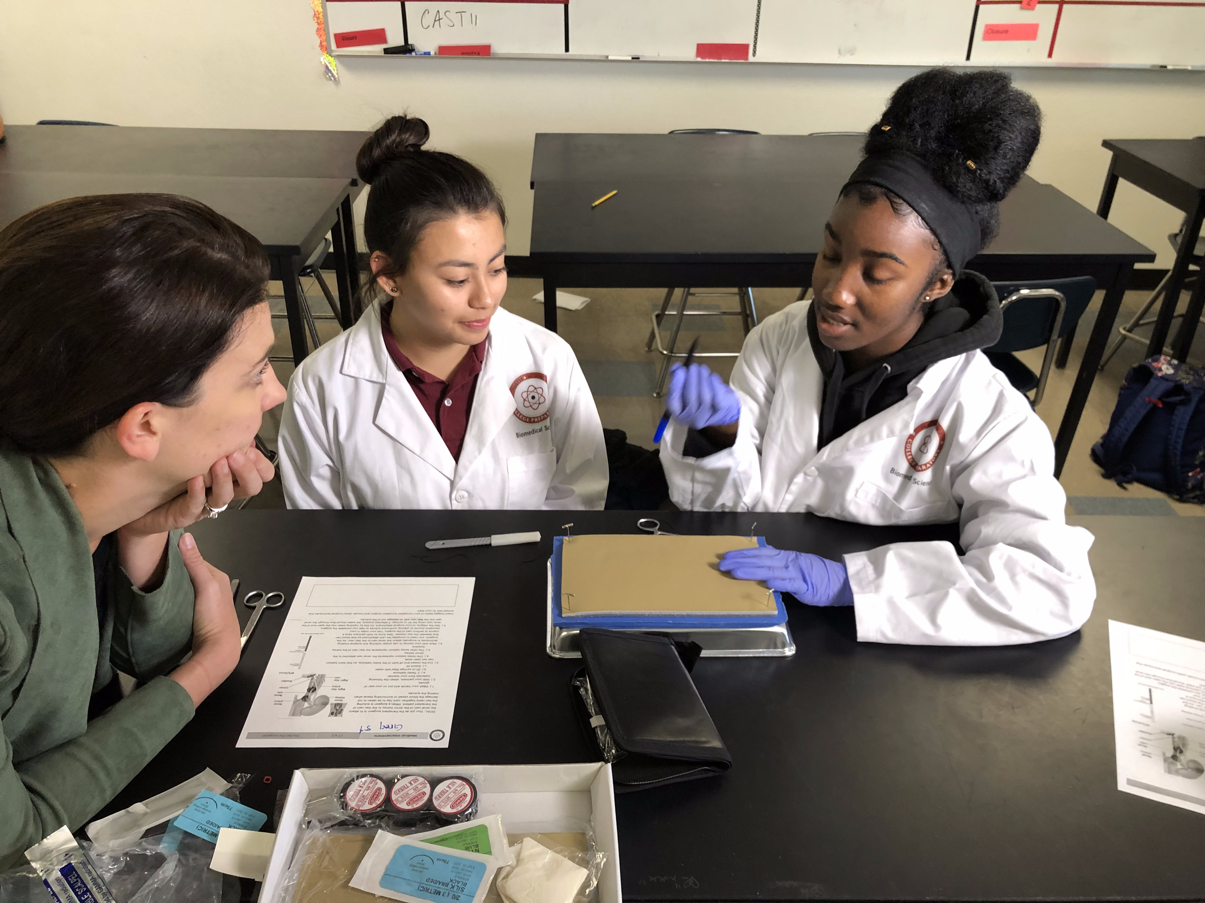 image of students performing science experiment