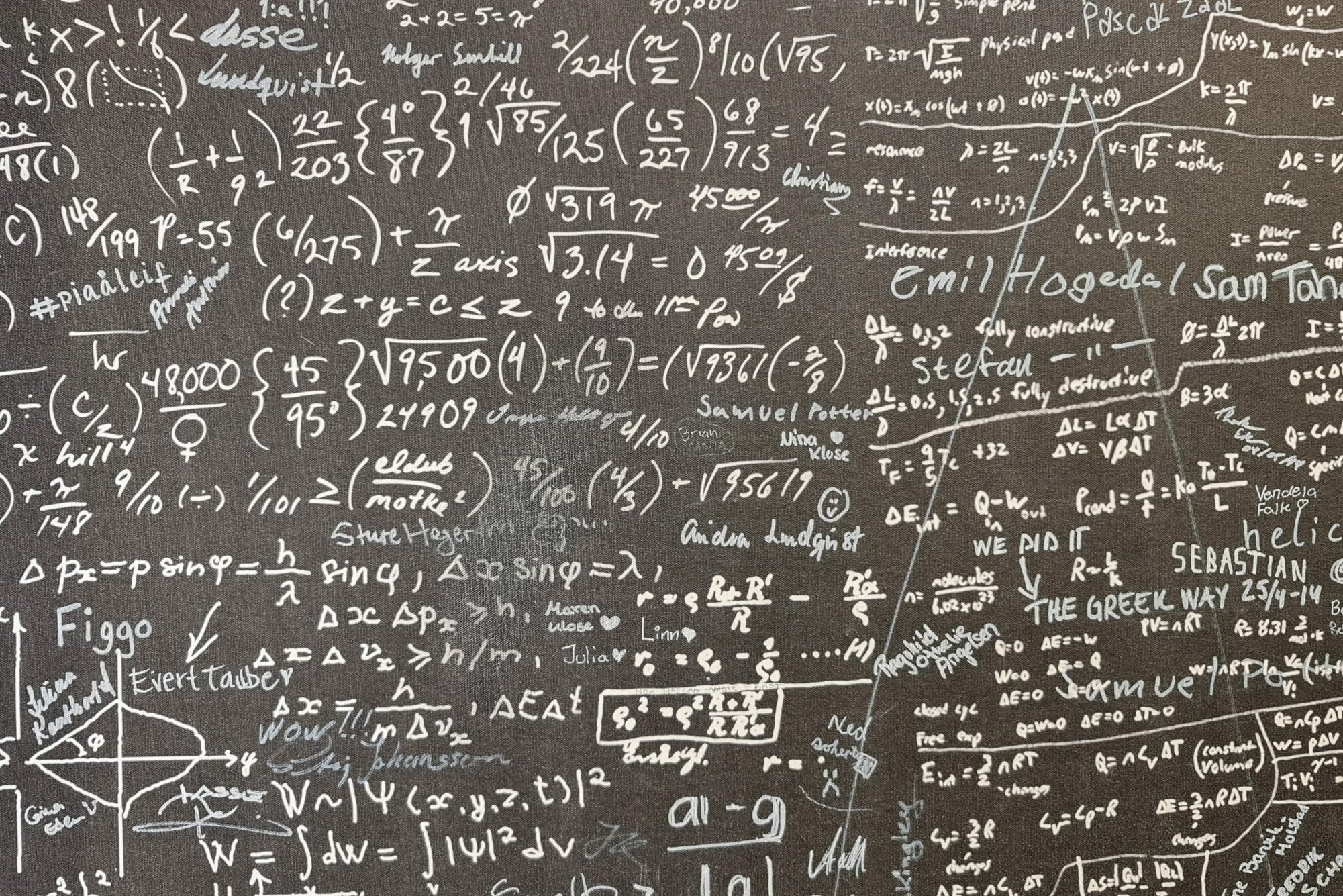 image of mathematical proof on black board